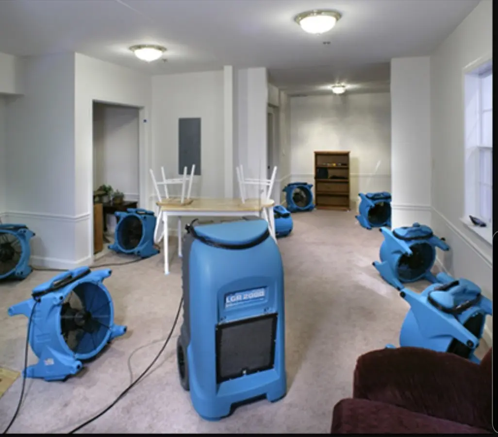 Air movers and dehumidifier setup for Water Damage Restoration in Garden City